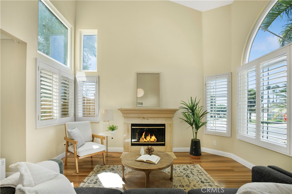 22705 Robin Way Grand Terrace, CA 92313 - Photo 3 of 15 a living room with furniture and a fireplace