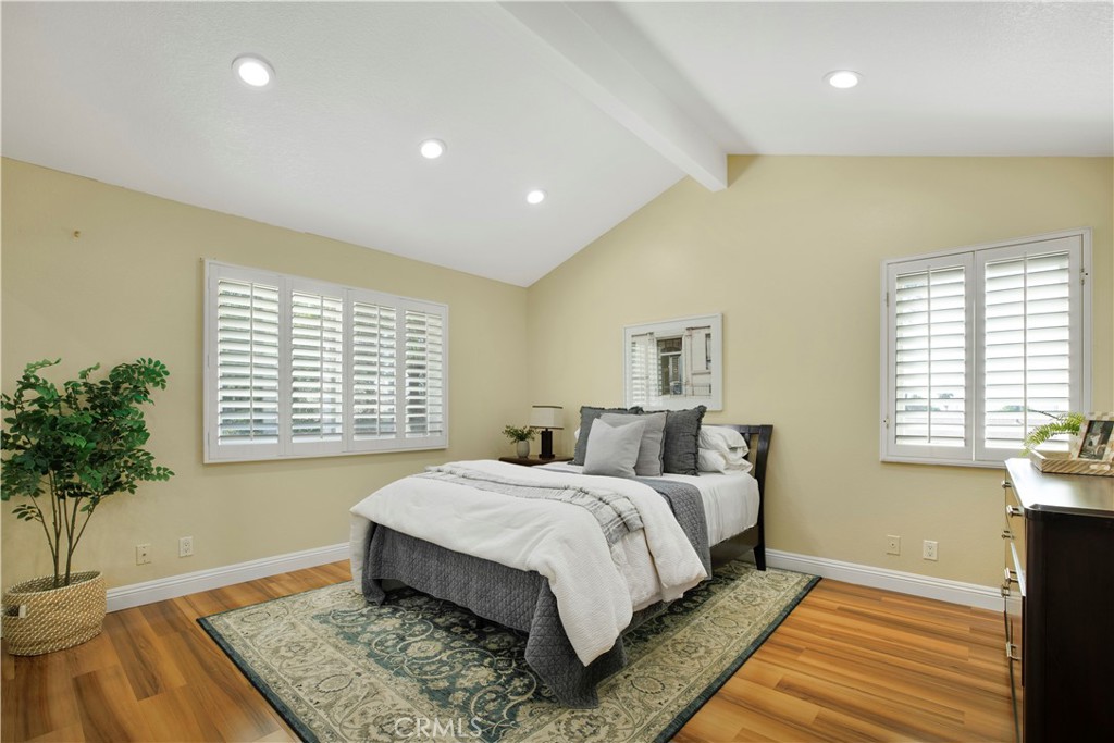 22705 Robin Way Grand Terrace, CA 92313 - Photo 8 of 15 a bed sitting in a spacious bedroom next to a window