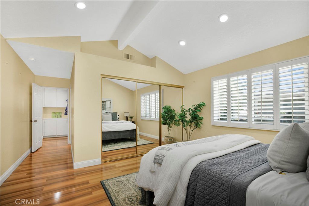 22705 Robin Way Grand Terrace, CA 92313 - Photo 9 of 15 a spacious bedroom with a large bed and a large window