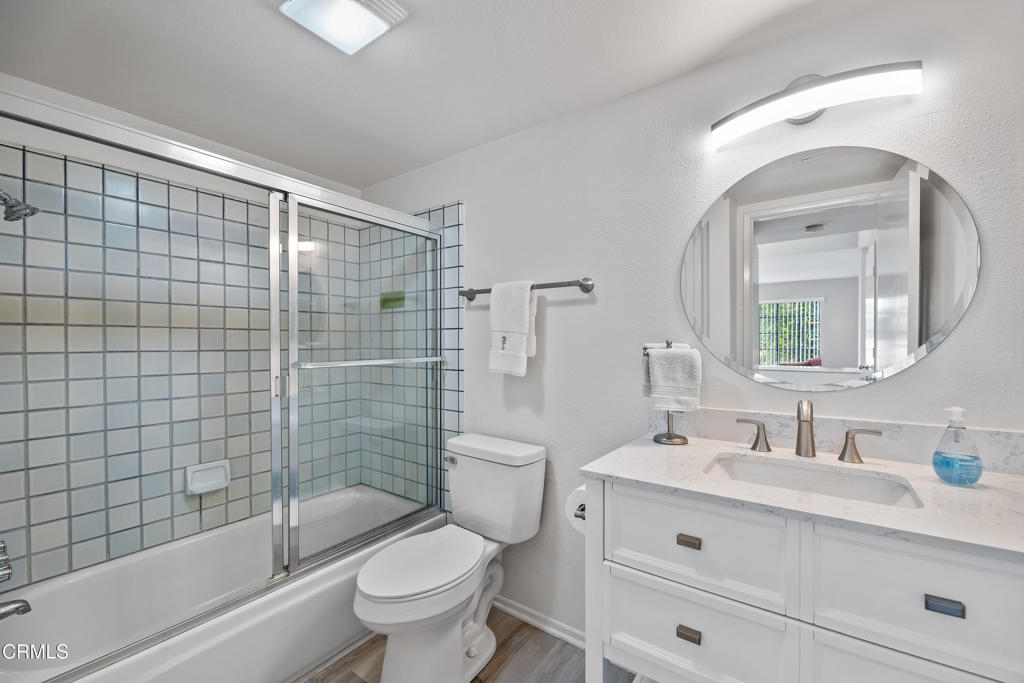 4427 Antigua Way Oxnard, CA 93035 - Photo 21 of 43 a bathroom with a bathtub shower sink mirror vanity and toilet