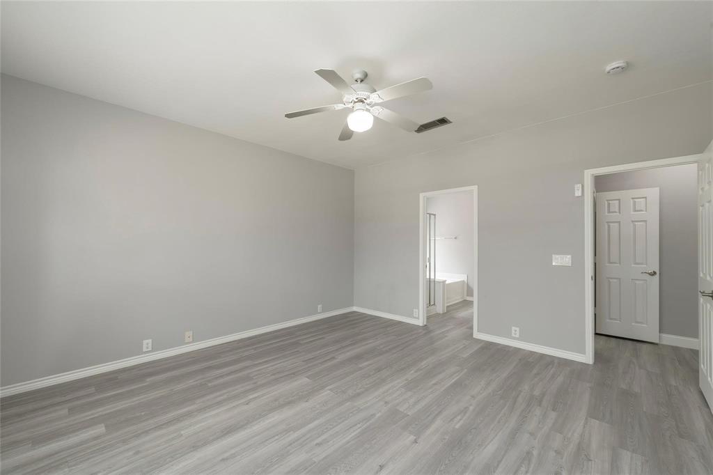 2313 Hunters Run Drive Plano, TX 75025 - Photo 20 of 36 a view of an empty room and wooden floor