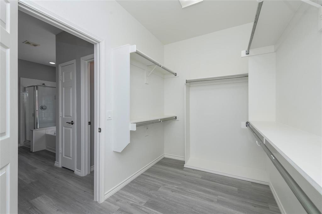2313 Hunters Run Drive Plano, TX 75025 - Photo 24 of 36 a view of a hallway with wooden floor