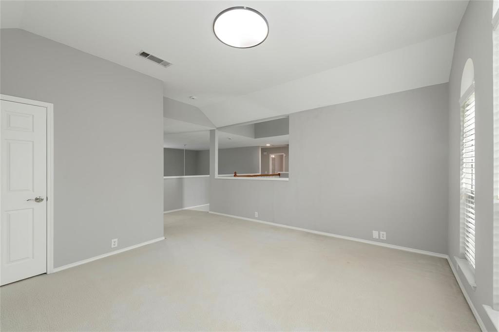 2313 Hunters Run Drive Plano, TX 75025 - Photo 28 of 36 an empty room with windows