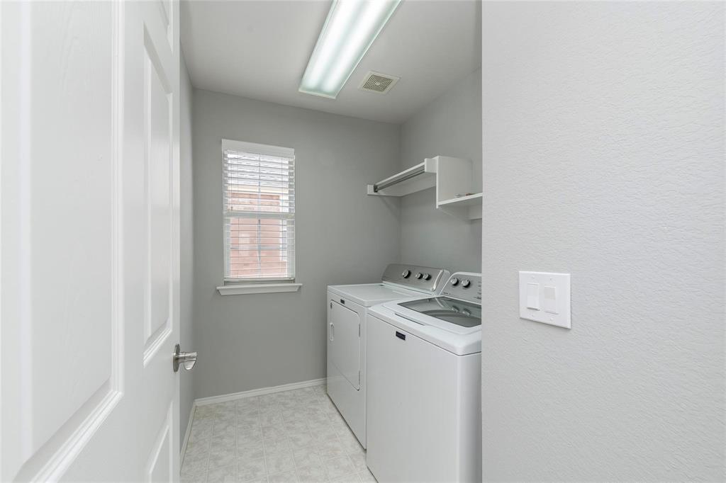 2313 Hunters Run Drive Plano, TX 75025 - Photo 29 of 36 a room with storage and utility