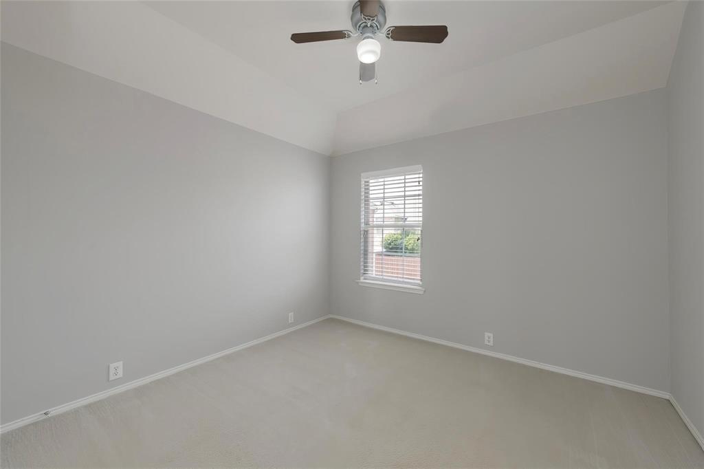 2313 Hunters Run Drive Plano, TX 75025 - Photo 30 of 36 an empty room with a window and ceiling fan