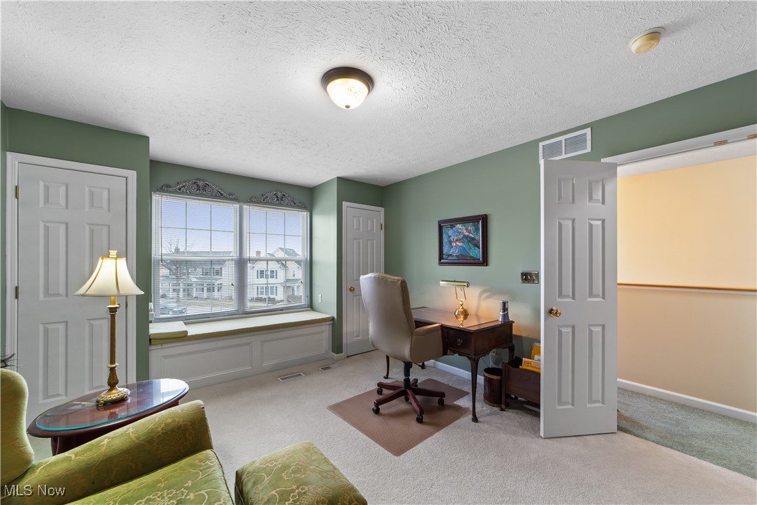 4461 Sexton Road Cleveland, OH 44105 - Photo 23 of 47 Carpeted bedroom featuring a textured ceiling