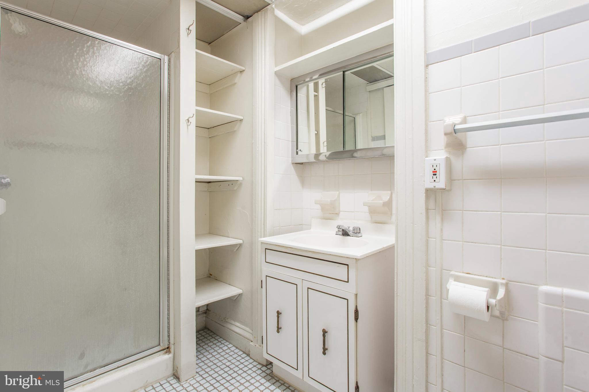1807 Spruce Street, Unit 2F Philadelphia, PA 19103 - Photo 12 of 17 a bathroom with a sink a toilet and shower