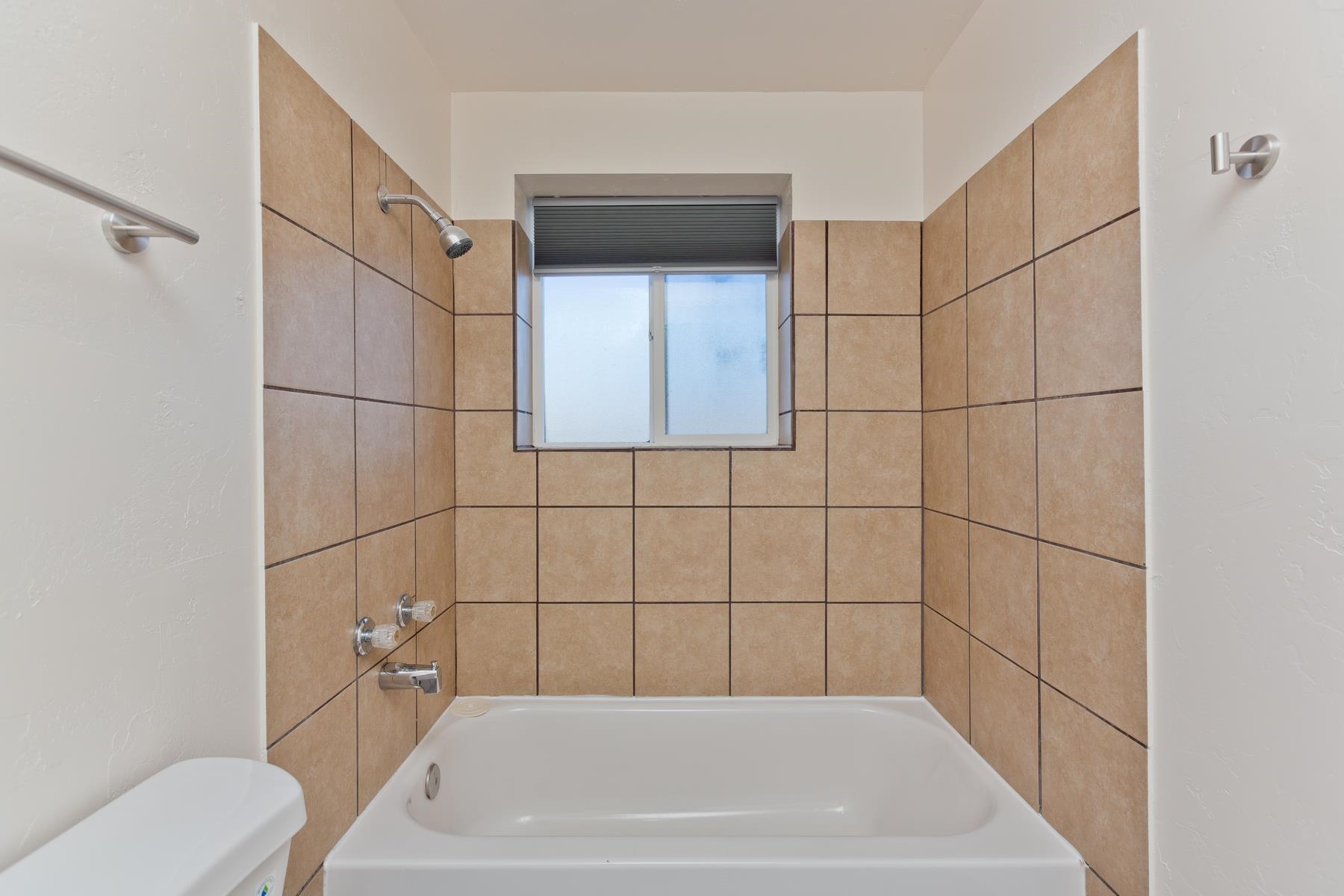3212 D D 1/4 Road Clifton, CO 81520 - Photo 16 of 25 a bathroom with a bathtub and toilet