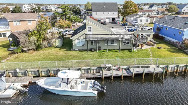 a balcony with table and chairs