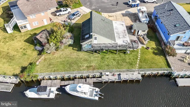 an aerial view of a house with outdoor space