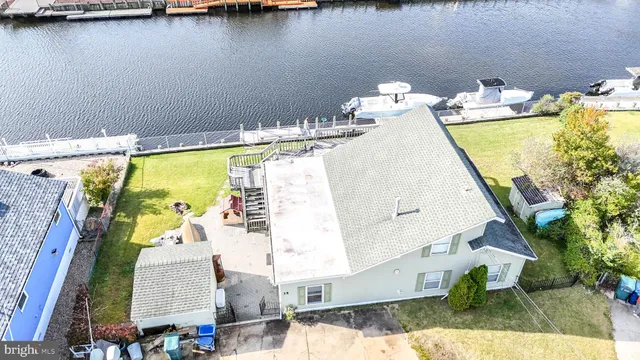 an aerial view of a house with swimming pool