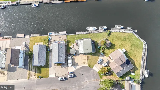 an aerial view of a house with a swimming pool