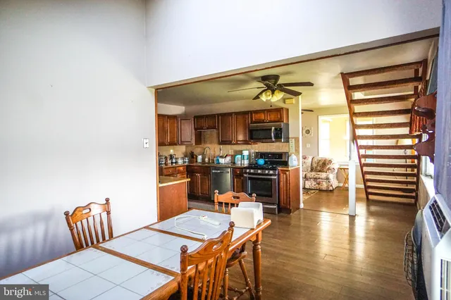 a kitchen with a table and chairs in it