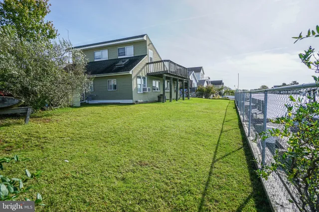 a view of a big yard with plants and a small yard