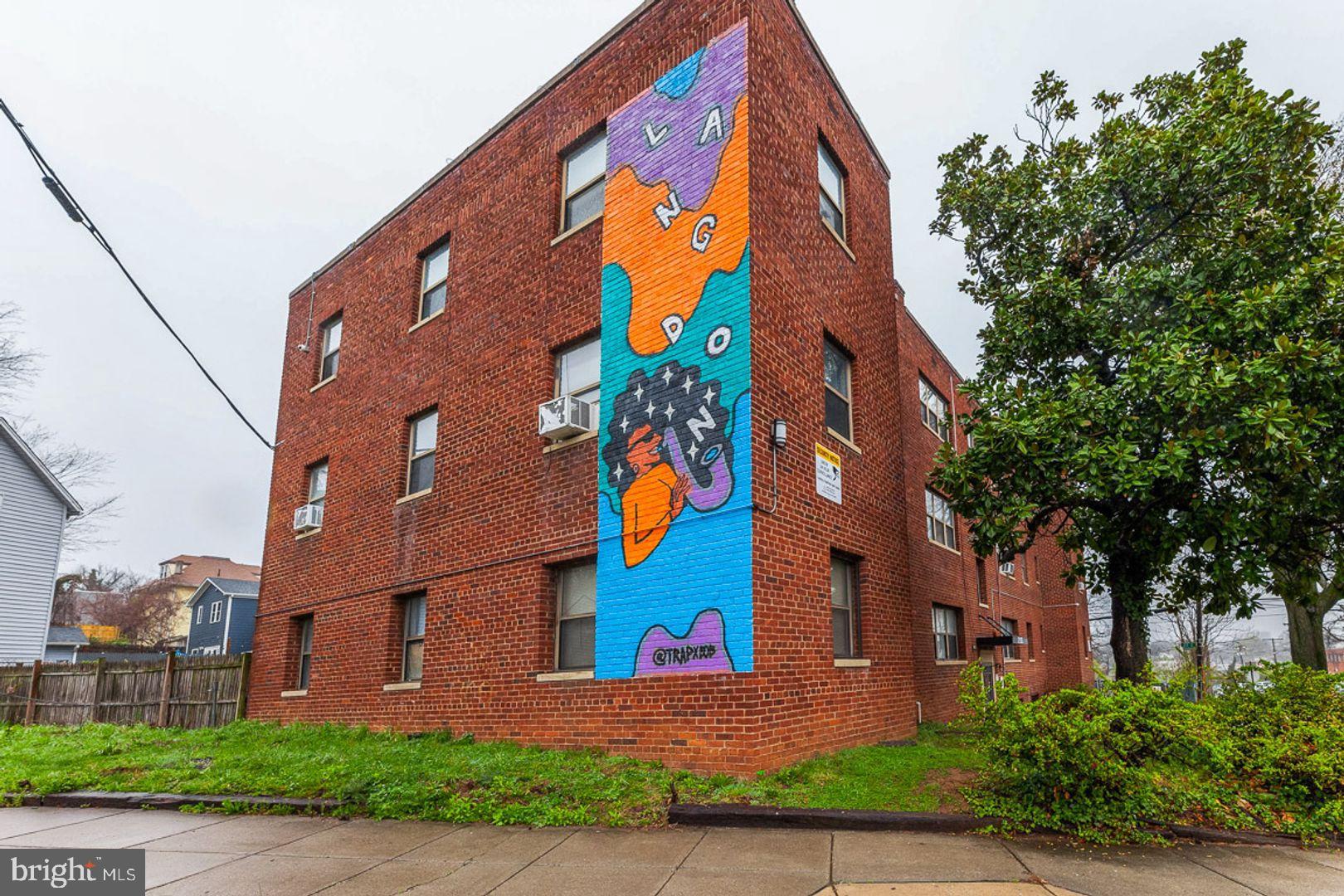 2100 Channing Street Northeast, Unit 2A Washington, DC 20018 - Photo 1 of 8 Vibrant mural brightens brick apartment facade.