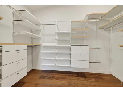 a view of an empty walk in closet