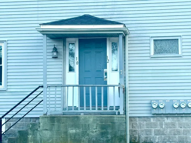 a view of a house with a small yard
