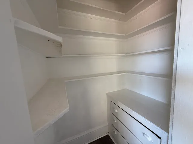 a view of an empty walk in closet