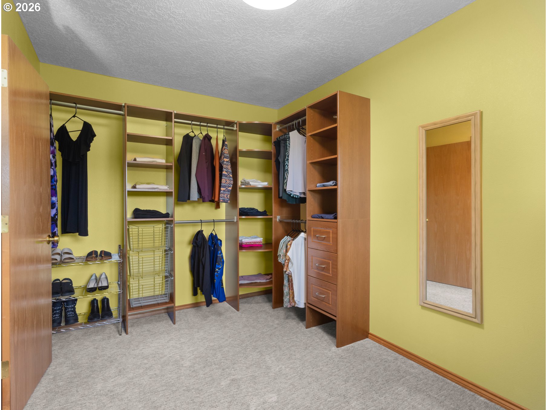 366 Southwest 37th Circle Gresham, OR 97080 - Photo 27 of 47 a view of walk in closet with clothes and shoes