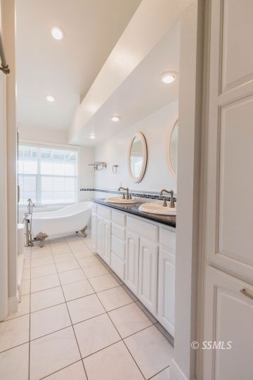 919 Beverly Court Ridgecrest, CA 93555 - Photo 19 of 29 a bathroom with a sink a toilet and a mirror