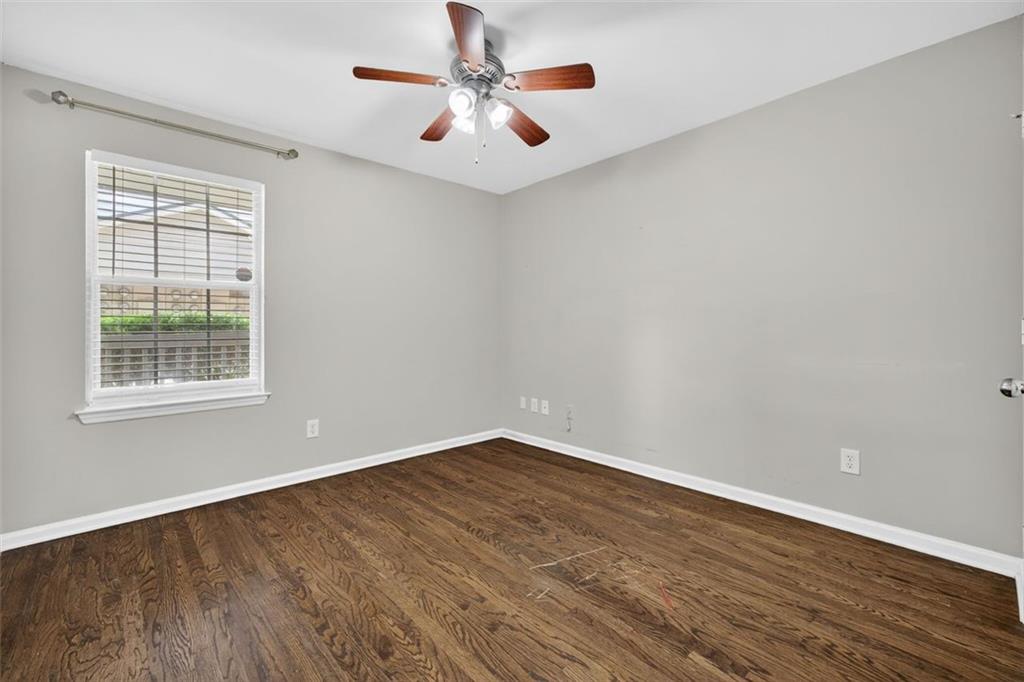 3063 Chastain Park Court Northeast Atlanta, GA 30342 - Photo 13 of 24 wooden floor in an empty room with a window