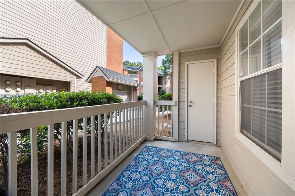 3063 Chastain Park Court Northeast Atlanta, GA 30342 - Photo 17 of 24 a view of a balcony with wooden floor