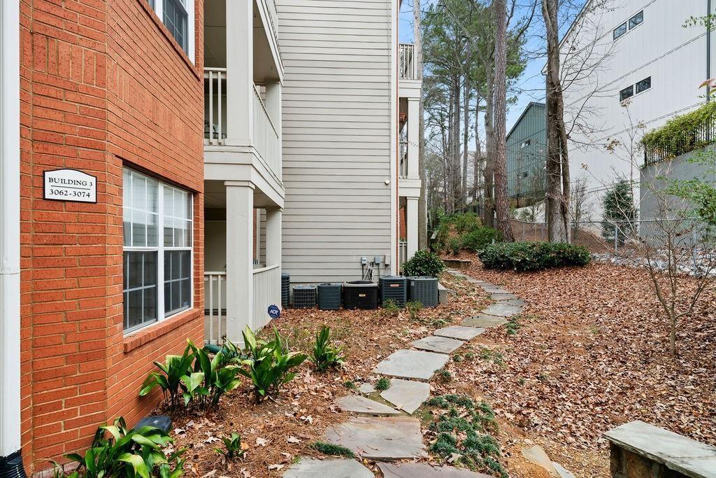 3063 Chastain Park Court Northeast Atlanta, GA 30342 - Photo 20 of 24 a backyard of a house with lots of green space