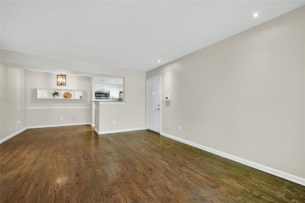 3063 Chastain Park Court Northeast Atlanta, GA 30342 - Photo 7 of 24 a view of empty room with wooden floor