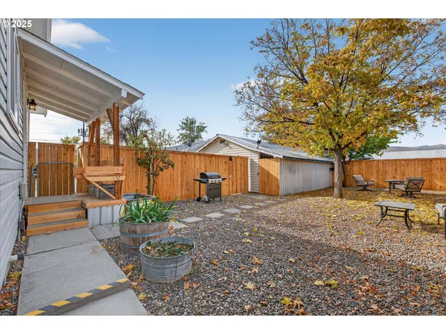 a view of a backyard with a patio