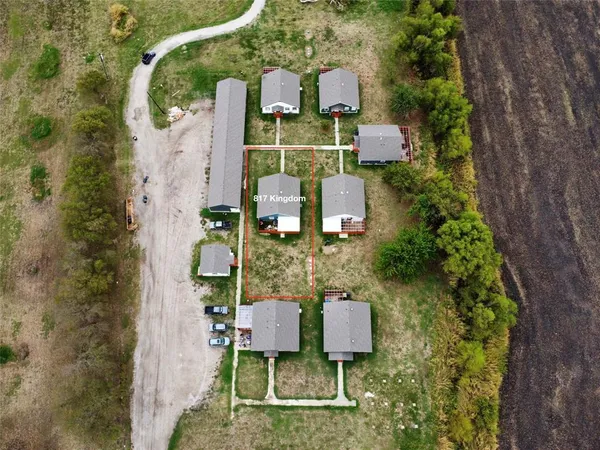 an aerial view of a house with outdoor space