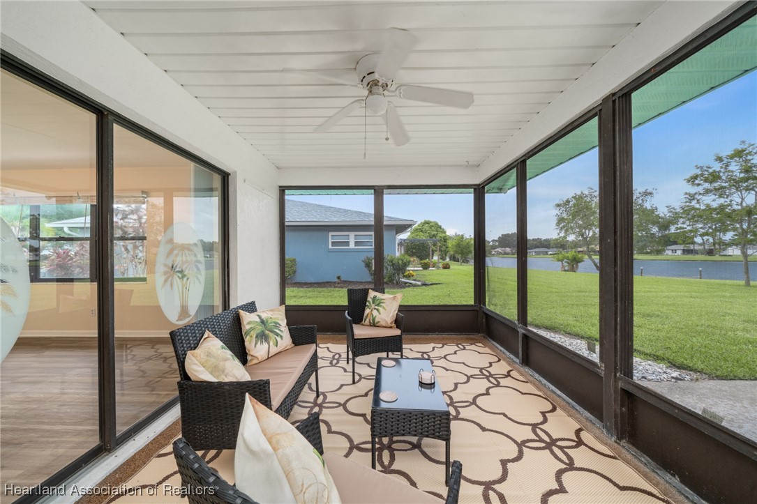 2713 Par Road Sebring, FL 33872 - Photo 20 of 26 Enjoy the mornings soaking in the lake breeze and scenery from the
spacious screened porch. Patio furniture included