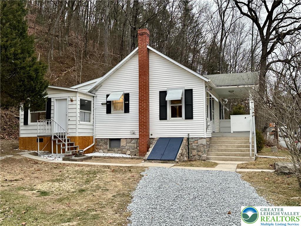 341 Berger Creek Road Lehighton, PA 18235 - Photo 12 of 17 a view of a white house with large windows next to a road