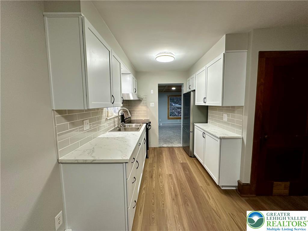 341 Berger Creek Road Lehighton, PA 18235 - Photo 6 of 17 a kitchen with a sink stove and refrigerator