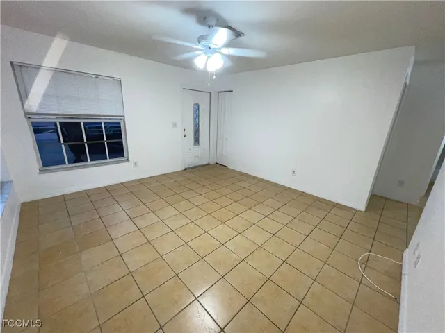 a view of empty room with windows