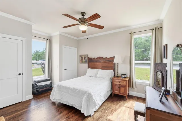 a bathroom with a granite countertop sink a mirror and a shower