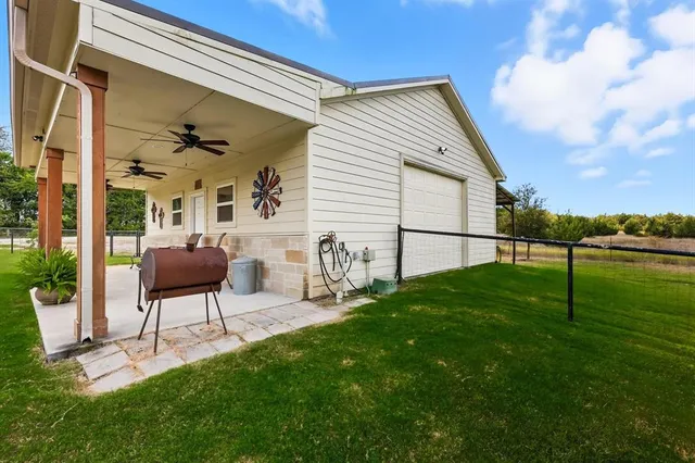 a view of a house with backyard porch and garden
