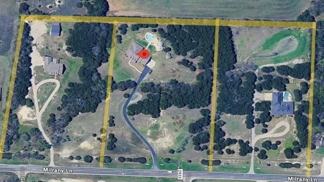 a house view with a sitting space and garden