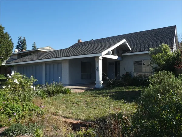 a front view of house with garden