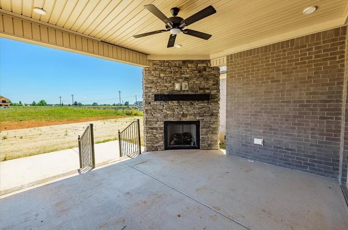 3023 Barretts Ridge Drive Murfreesboro, TN 37130 - Photo 32 of 33 a view of a livingroom with a fireplace and a fan