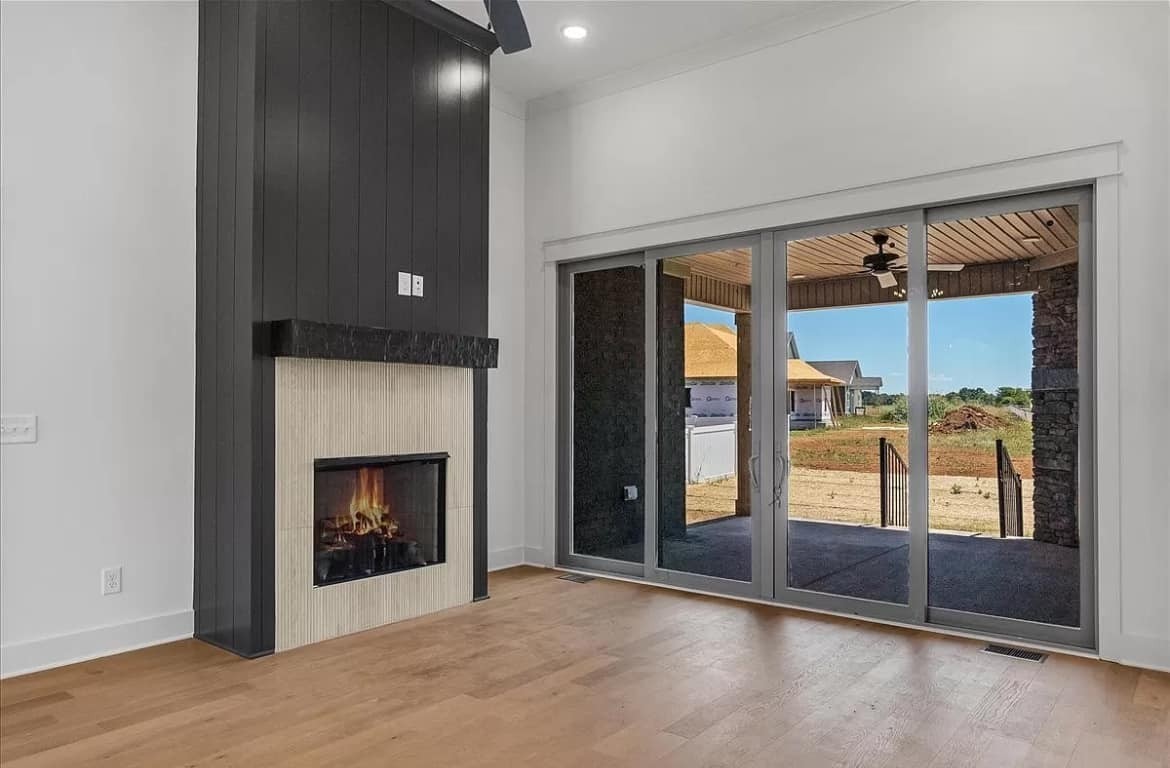 3023 Barretts Ridge Drive Murfreesboro, TN 37130 - Photo 4 of 33 a view of an empty room with glass door and a fireplace