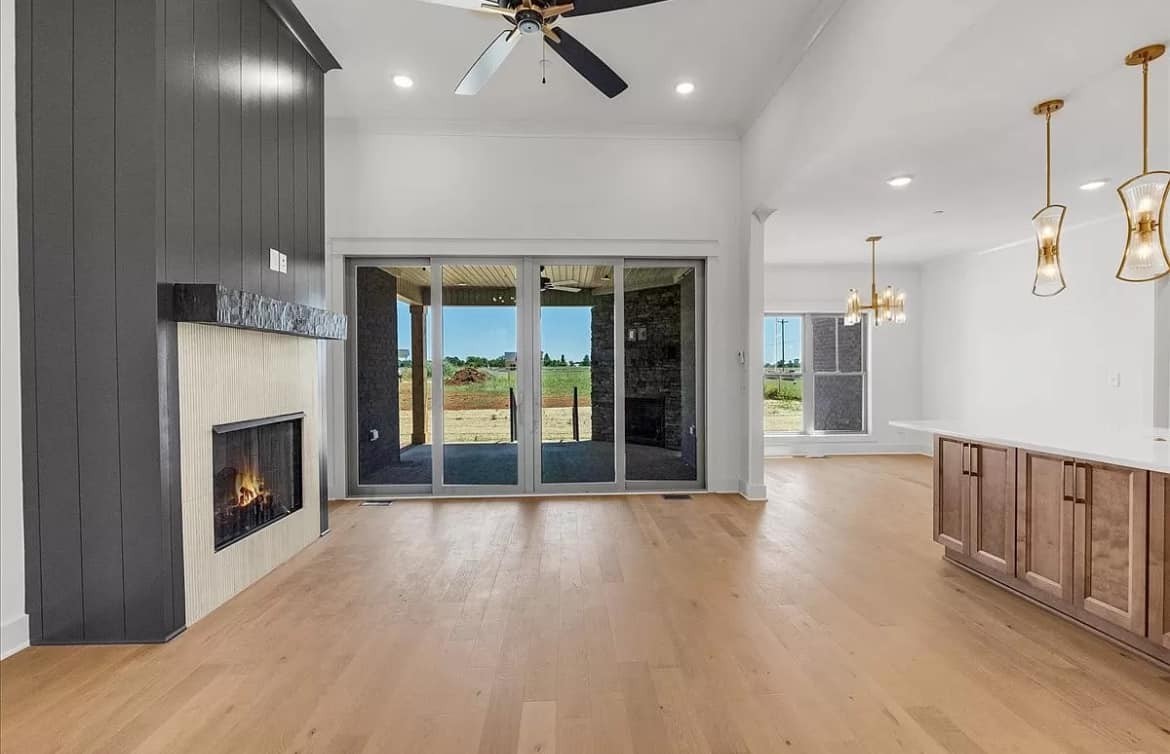 3023 Barretts Ridge Drive Murfreesboro, TN 37130 - Photo 5 of 33 wooden floor fireplace and windows in an empty room