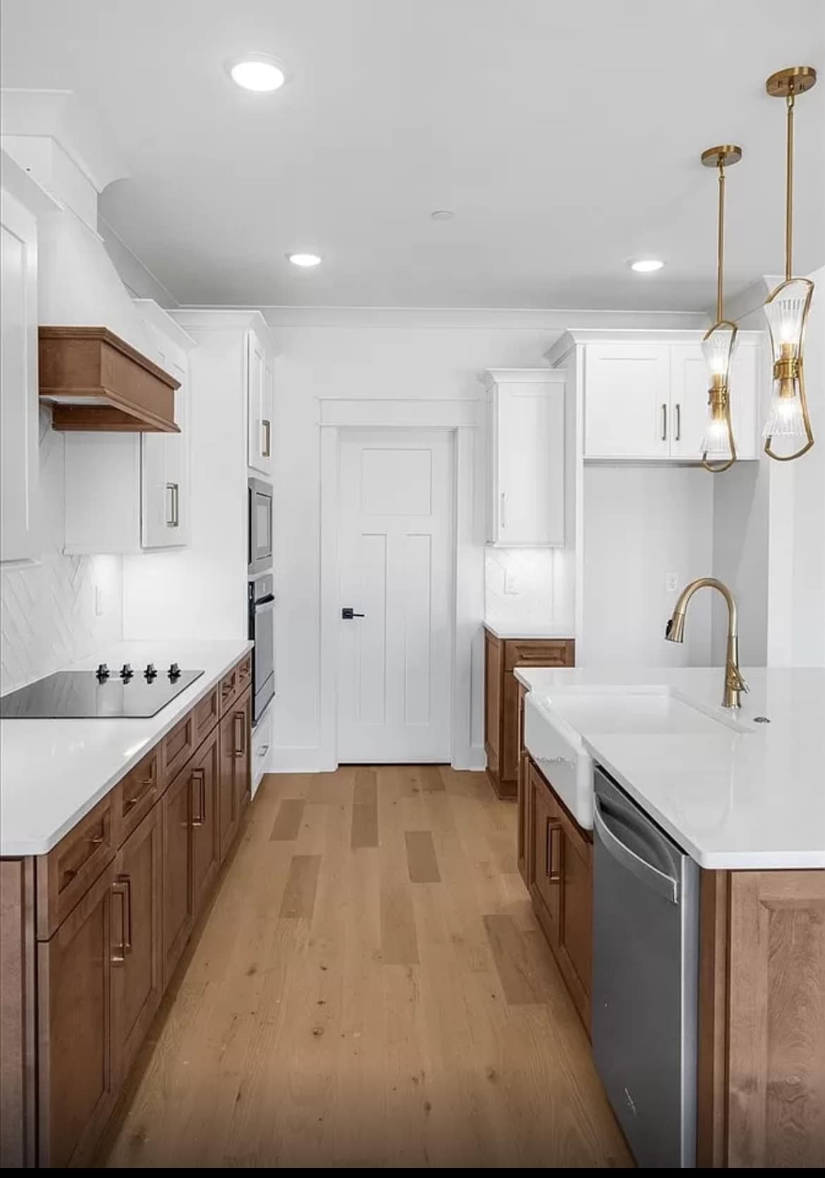 3023 Barretts Ridge Drive Murfreesboro, TN 37130 - Photo 10 of 33 a kitchen with a sink and a stove top oven with wooden floor