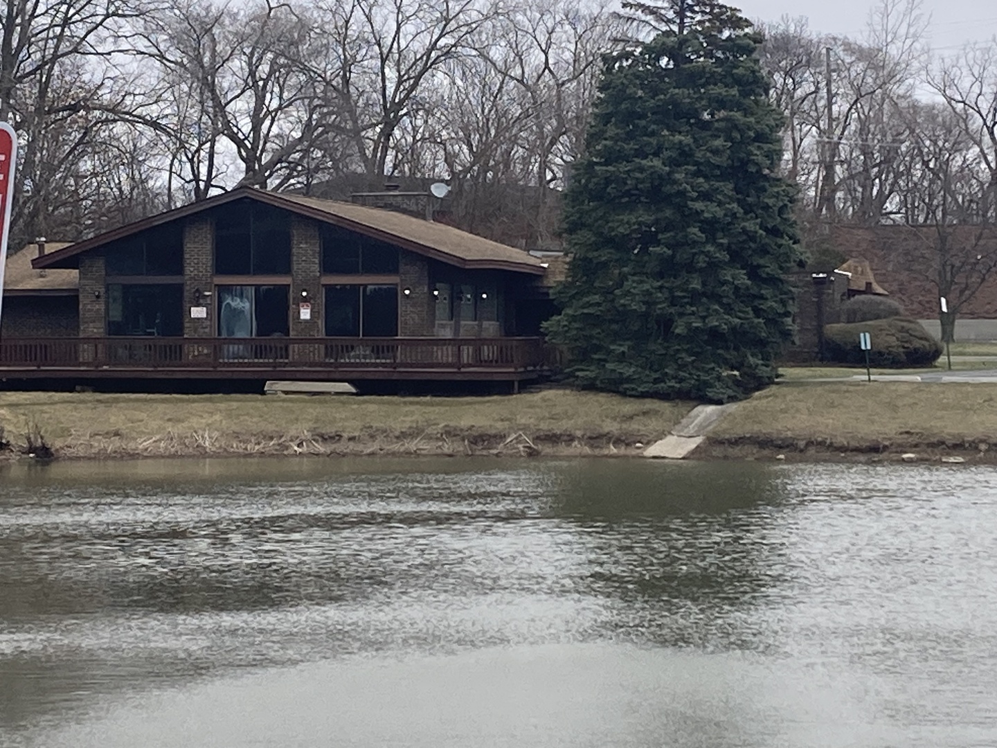 a house that has a tree in front of it