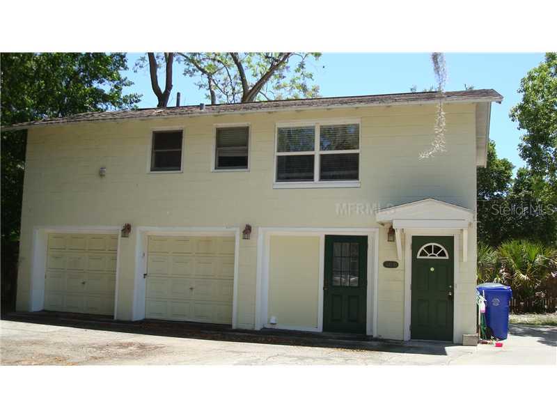 a black car parked in front of a building