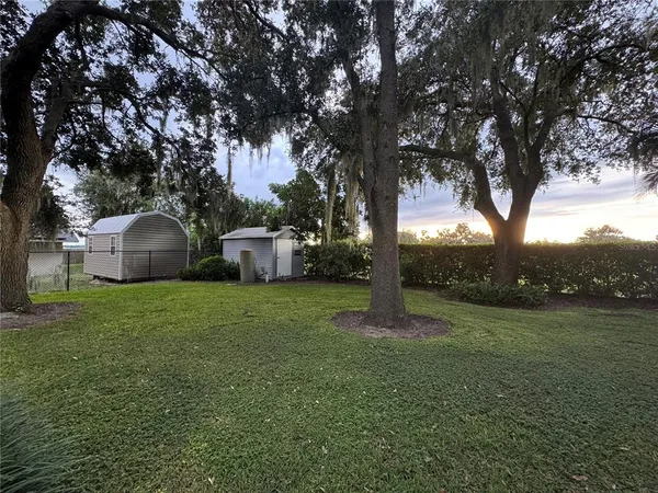 a backyard of a house with lots of green space