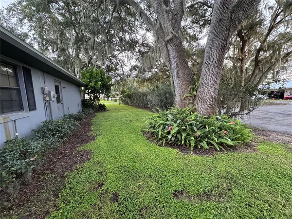 a backyard of a house with lots of green space