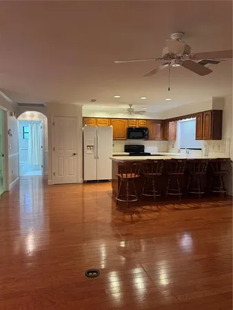 a bathroom with a toilet a sink and a mirror
