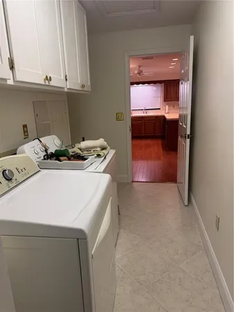 a view of empty room with large windows