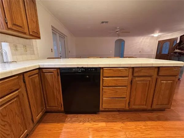 a kitchen with a sink and cabinets