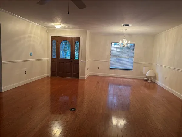 a view of a livingroom with wooden floor